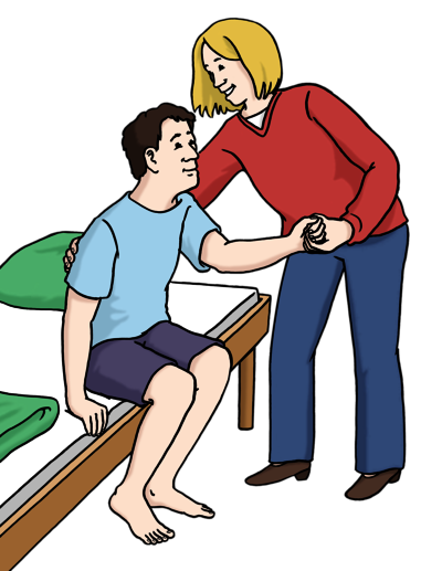 Eine Pflegerin hilft einem jungen kranken Mann aus dem Bett