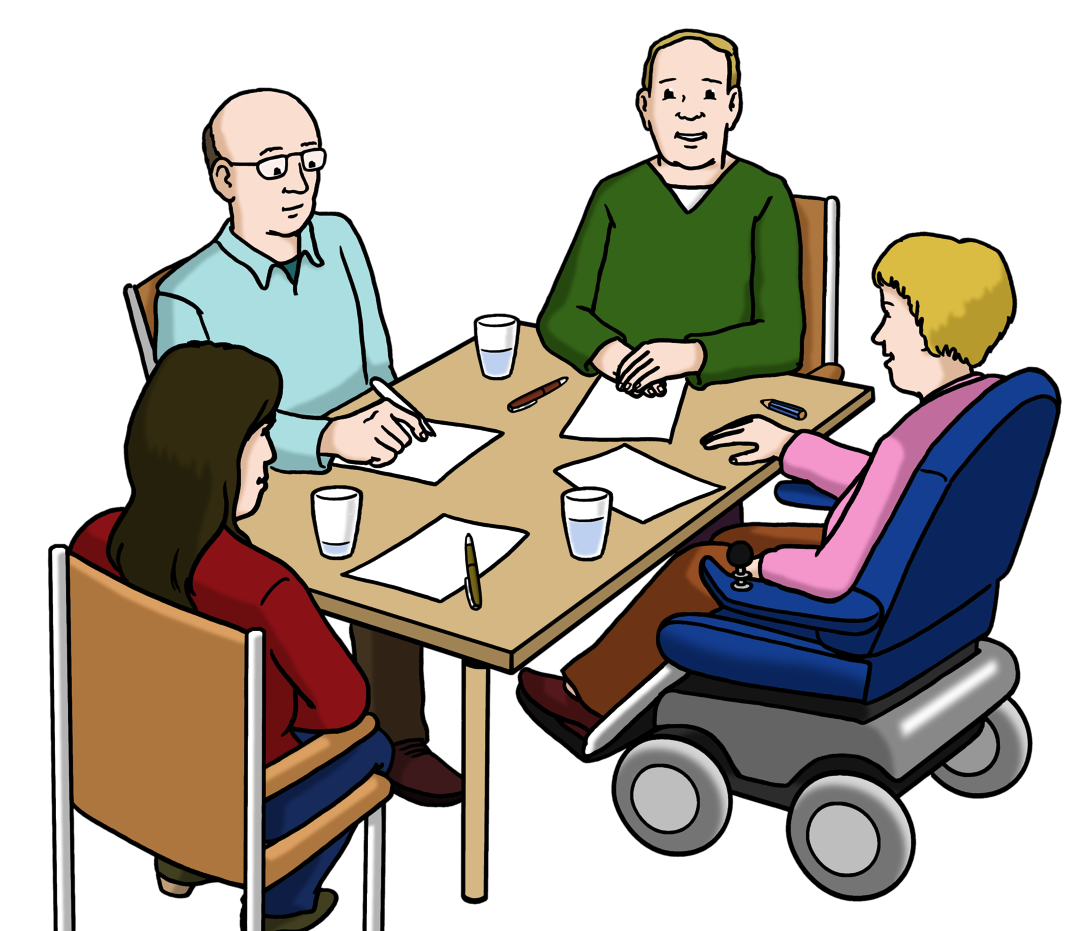 Eine Gruppe von Menschen sitzt gemeinsam am Tisch